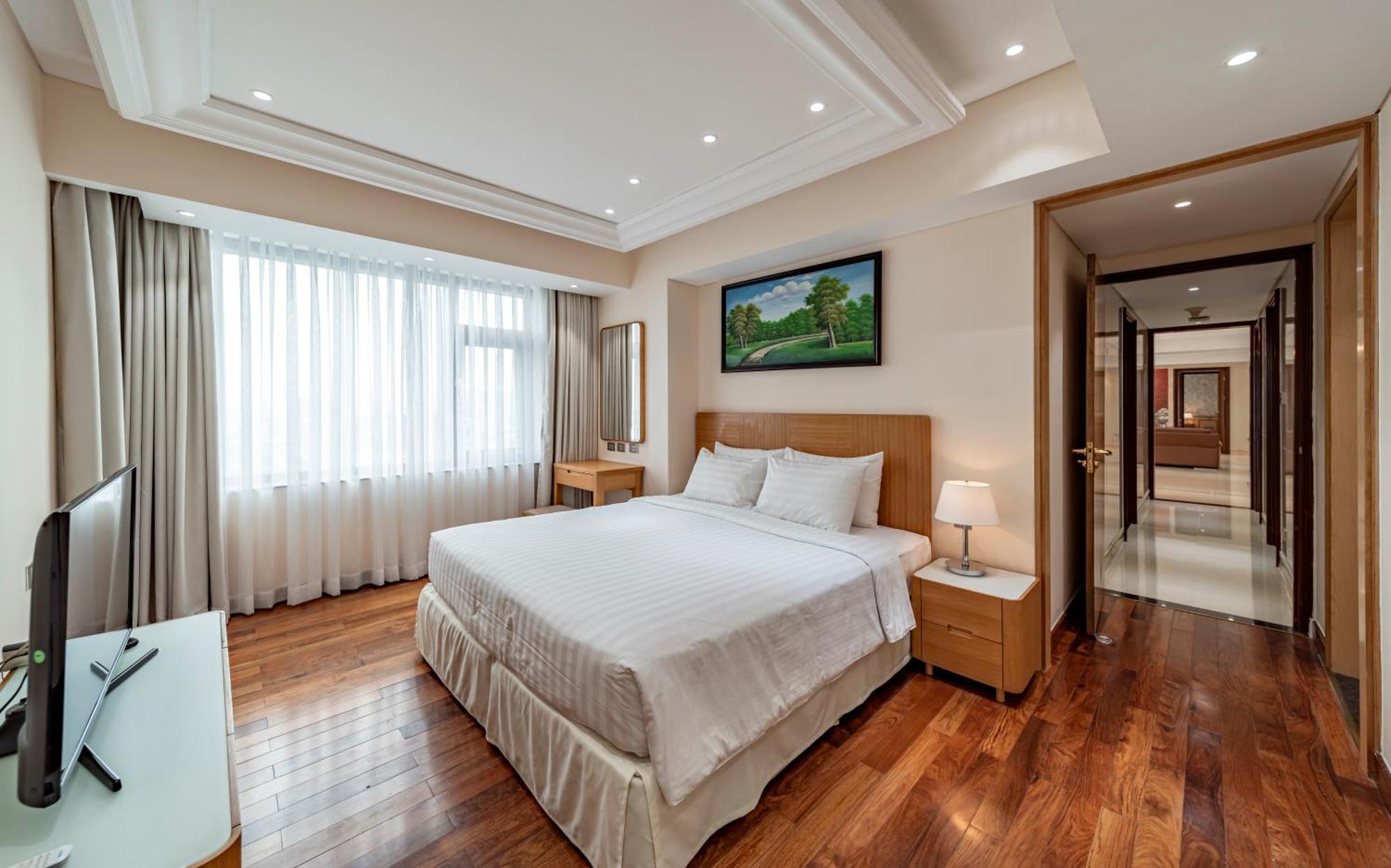 Sherwood Residence Ho Si Minh-város Kültér fotó A bedroom at the hotel