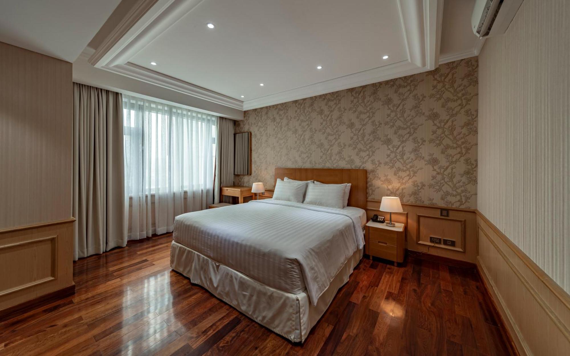 Sherwood Residence Ho Si Minh-város Kültér fotó A bedroom at the hotel