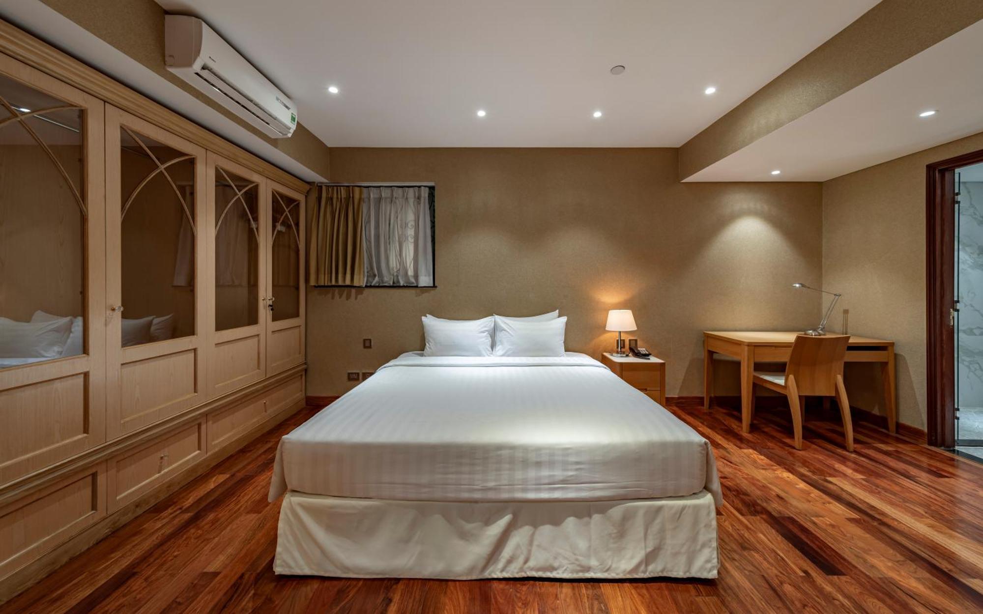 Sherwood Residence Ho Si Minh-város Kültér fotó A bedroom at the hotel